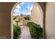 Charming courtyard with archways and lush greenery at 3418 E Las Rocas Dr, Phoenix, AZ 85028