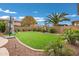 Beautifully landscaped backyard with artificial turf and play area at 3457 E Virgil Dr, Gilbert, AZ 85298