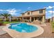 Inviting kidney-shaped pool with spacious patio and outdoor kitchen at 3457 E Virgil Dr, Gilbert, AZ 85298