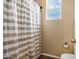 Simple bathroom with shower/tub combo and striped shower curtain at 3457 E Virgil Dr, Gilbert, AZ 85298