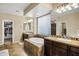 Spa-like bathroom featuring a large soaking tub, double vanity, and walk-in closet at 3457 E Virgil Dr, Gilbert, AZ 85298