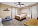 Cozy bedroom with a double bed and built in shelving at 3457 E Virgil Dr, Gilbert, AZ 85298