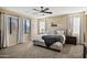 Spacious bedroom with large windows and ceiling fan at 3457 E Virgil Dr, Gilbert, AZ 85298