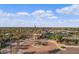 Circular community entrance with lush landscaping and flag poles at 3457 E Virgil Dr, Gilbert, AZ 85298