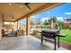 Relaxing covered patio with outdoor furniture and Blackstone grill at 3457 E Virgil Dr, Gilbert, AZ 85298