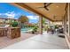 Spacious covered patio with seating area, ceiling fans, and views of the pool at 3457 E Virgil Dr, Gilbert, AZ 85298
