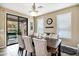 Dining room with farmhouse table and access to backyard patio at 3457 E Virgil Dr, Gilbert, AZ 85298