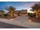 Two-story home with a three-car garage and palm trees at 3457 E Virgil Dr, Gilbert, AZ 85298