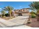 Beautiful two-story home with a three-car garage and palm trees at 3457 E Virgil Dr, Gilbert, AZ 85298