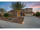 Two-story house with stone accents and palm trees at 3457 E Virgil Dr, Gilbert, AZ 85298