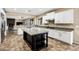 Kitchen boasts granite countertops, white cabinets, and a large island at 3457 E Virgil Dr, Gilbert, AZ 85298