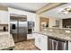 Modern kitchen with stainless steel appliances and granite countertops at 3457 E Virgil Dr, Gilbert, AZ 85298