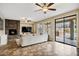 Cozy living room features a fireplace and sliding glass doors leading to the backyard at 3457 E Virgil Dr, Gilbert, AZ 85298