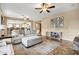 Bright living room with comfy sectional sofa and access to kitchen at 3457 E Virgil Dr, Gilbert, AZ 85298
