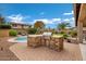 Built-in outdoor kitchen with stainless steel grill and stone countertops at 3457 E Virgil Dr, Gilbert, AZ 85298