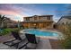 Relaxing kidney-shaped pool with lounge chairs at 3457 E Virgil Dr, Gilbert, AZ 85298