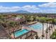 Community lap pool, leisure pool, and clubhouse with palm trees at 3457 E Virgil Dr, Gilbert, AZ 85298