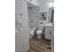 Bright bathroom with modern fixtures, white vanity, and a shower-tub combo with tiled surround at 3614 N 48Th Dr, Phoenix, AZ 85031