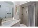 Updated bathroom with marble shower and modern vanity at 3614 N 48Th Dr, Phoenix, AZ 85031