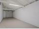 Attached garage with high ceilings and epoxy flooring at 3614 N 48Th Dr, Phoenix, AZ 85031