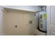 Laundry area with shelving, water hookups and a water heater at 3614 N 48Th Dr, Phoenix, AZ 85031