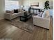 Cozy living room with neutral sofas, a modern area rug, and stylish decor for a comfortable atmosphere at 3614 N 48Th Dr, Phoenix, AZ 85031