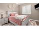 Bright bedroom with a whitewashed wood bed frame at 36709 N Stoneware Dr, San Tan Valley, AZ 85140