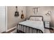 Cozy bedroom with a metal bed frame and unique decor at 36709 N Stoneware Dr, San Tan Valley, AZ 85140