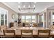Elegant dining room showcasing a rustic wood table and chandelier at 36709 N Stoneware Dr, San Tan Valley, AZ 85140