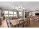 Spacious dining area with a large table and views of the backyard at 36709 N Stoneware Dr, San Tan Valley, AZ 85140