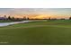 Scenic golf course with water feature at sunset at 36709 N Stoneware Dr, San Tan Valley, AZ 85140