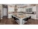 Island kitchen with granite countertops, white cabinets, and stainless steel appliances at 36709 N Stoneware Dr, San Tan Valley, AZ 85140