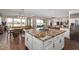 Open kitchen with granite island, breakfast bar, and views to the backyard at 36709 N Stoneware Dr, San Tan Valley, AZ 85140