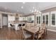 Modern kitchen with white cabinets, a large island, and high end appliances at 36709 N Stoneware Dr, San Tan Valley, AZ 85140