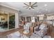 Open living room with a view of the kitchen and dining area at 36709 N Stoneware Dr, San Tan Valley, AZ 85140