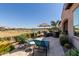 Spacious patio with seating area overlooking golf course at 36709 N Stoneware Dr, San Tan Valley, AZ 85140