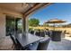 Relaxing patio with outdoor seating and golf course views at 36709 N Stoneware Dr, San Tan Valley, AZ 85140
