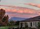 Charming home exterior with well-manicured landscaping and mountain views in the background at 36709 N Stoneware Dr, San Tan Valley, AZ 85140