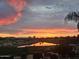 Beautiful lake view with an amazing Arizona sunset, reflected in the water and sky at 36709 N Stoneware Dr, San Tan Valley, AZ 85140