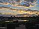 Beautiful lake view with an Arizona sunset, with the sun reflecting on the pond at 36709 N Stoneware Dr, San Tan Valley, AZ 85140