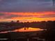 Beautiful lake view with an amazing Arizona sunset, reflected in the water at 36709 N Stoneware Dr, San Tan Valley, AZ 85140