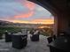 Patio view of the property overlooking the lake and golf course with an amazing sunset at 36709 N Stoneware Dr, San Tan Valley, AZ 85140