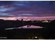 Picturesque sunset view over the pond, casting colorful reflections on the tranquil water at 36709 N Stoneware Dr, San Tan Valley, AZ 85140