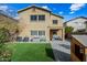 Backyard with patio, artificial turf, and playset at 3743 W Wayne Ln, Anthem, AZ 85086
