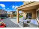 Backyard patio with seating area and artificial turf at 3743 W Wayne Ln, Anthem, AZ 85086