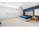 Main bedroom with plush bed, ceiling fan, and blue accent wall at 3743 W Wayne Ln, Anthem, AZ 85086
