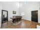 Bright dining room featuring hardwood floors, a dining table and a large mirror at 3743 W Wayne Ln, Anthem, AZ 85086