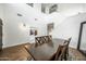 Dining area with hardwood floors, a wooden table, and high ceilings at 3743 W Wayne Ln, Anthem, AZ 85086