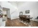 Spacious dining room with hardwood floors and a large dining table at 3743 W Wayne Ln, Anthem, AZ 85086
