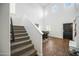 Bright entryway with staircase, hardwood floors, and view of dining area at 3743 W Wayne Ln, Anthem, AZ 85086